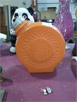 Orange glass container.
