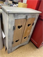 Paint decorated storage cabinet.
