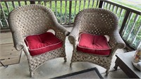 Two plastic wicker patio armchairs, with white