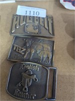 Three belt buckles