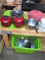 green tote kitchen items, pots and pans