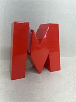 Letter M plastic bank