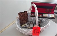 Basket with assorted watches, pins, letter openers