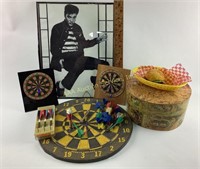 Elvis poster, dart boards, faux food