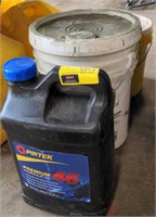 Bucket of latex waterproofing paint &hydraulic oil