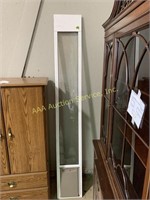 White window panel with pet safe slot on the