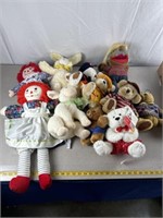 Stuffed animals including bears, sheep, bunny and