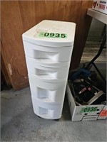 Four drawer plastic roll around caddy with