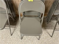 5 gray folding chairs
