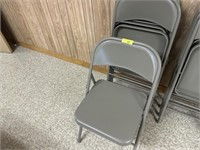 4 gray folding chairs