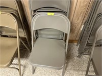 4 gray folding chairs