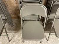 5 gray folding chairs