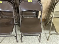 4 brown folding chairs
