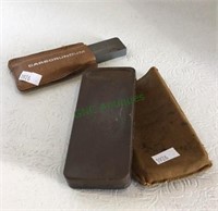 Two nice sharpening blocks with leather sleeves.