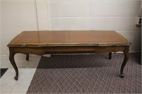 Coffee table, scalloped edge, leather inserts on