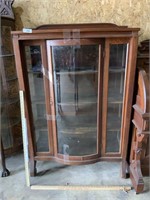 China cabinet with curved glass front door