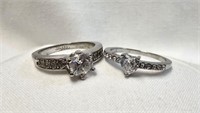 2 STERLING RINGS W/ CLEAR STONES STAMPED 18K