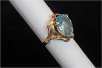 Gold Colored Ring With Pale Blue Stone