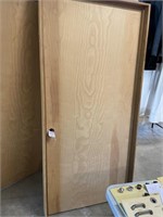 Solid wooden door in frame