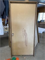 Solid wooden door in frame