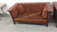 Mission oak love seat with cushions and pillows
