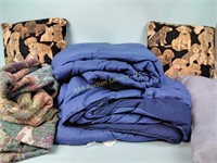 Doggy pillows and a throw comforter and a pillow