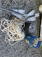 two large boat anchors and nylon rope