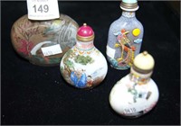 Set of 4 glass snuff bottles decorated with