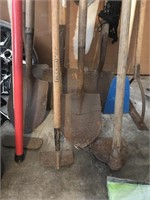 Assorted shovels and hosss