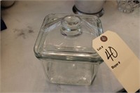 Covered square glass storage jar