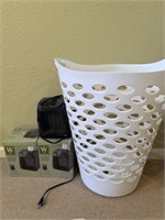 2 space heaters and laundry basket