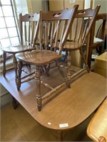 Kitchen table w/ 4 chairs & 4 leaves.