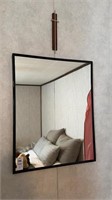 Small black mirror and small cross wall