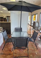 FROSTED GLASS PATIO TABLE, 4 CHAIRS, AND UMBRELLA