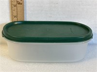 Tupperware clear with green lid, oblong, 7 x 2