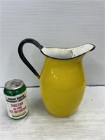 Yellow enamel pitcher with built in strainer
