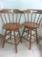 Vintage wooden swiveling bar chairs