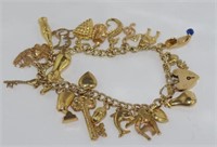 Good vintage 9ct yellow gold charm bracelet
