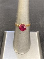 Ladies 10KT gold ring, red ruby stone.