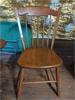 Four wooden dining room chairs