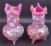 A pair of pink art glass vases decorated with