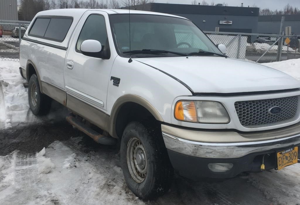 1999 Ford F150 with 4WD. Single cab with a long be