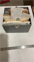 Filing box with vintage papers.
