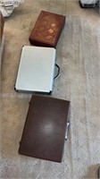 Two briefcases and one bound box with