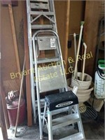 Three aluminum ladders
