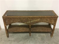 Wicker style long glass top table