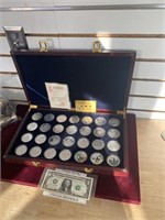 28 One Ounce Silver Panda coins with wood display