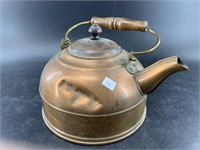 Antique copper tea kettle, one side is dented