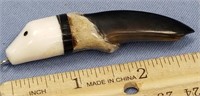 Seal claw with carved ivory head 3" long pendant