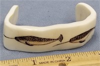 Ivory bracelet scrimmed with narwhales        (f 1